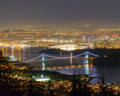 Bird’s eye night view of Lions Gate Bridge, Burrard Inlet, Vancouver Harbour, and all of Metro Vancouver from Cypress Bowl Rd