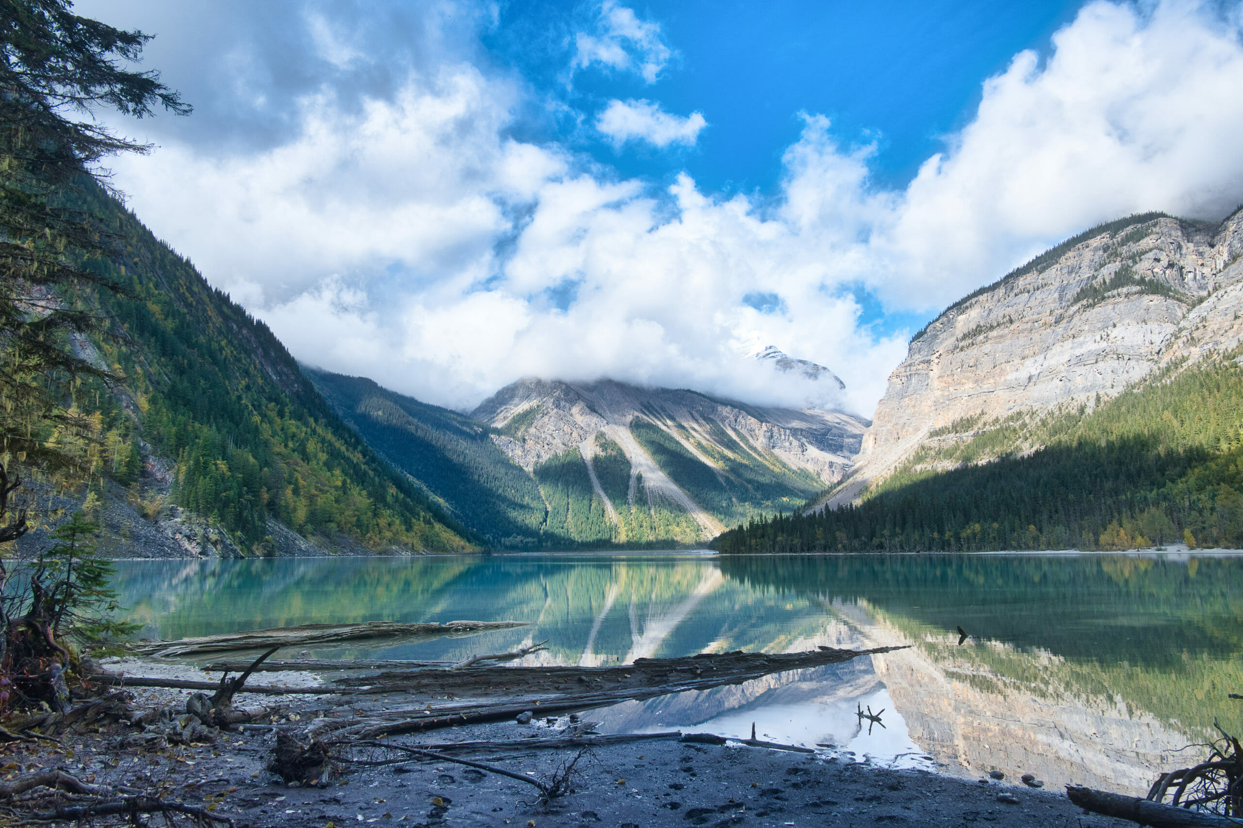 Whitehorn Mountain reflected in Kinney Lake covered in clouds on Berg Lake Trail in Mount Robson Provincial Park